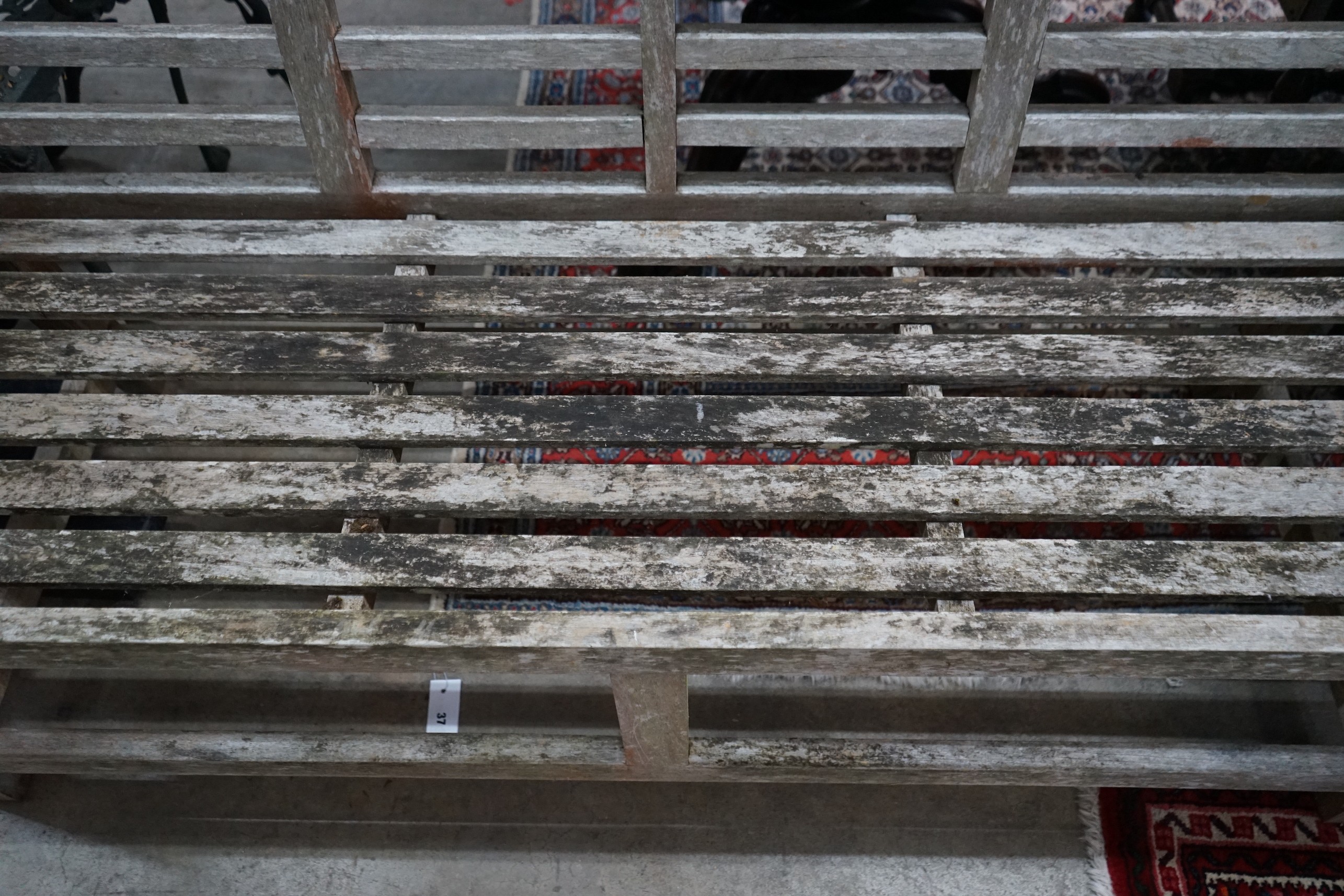 A Lutyens style weathered teak garden bench from 'The Cotswold Collection', width 166cm, depth 52cm, height 105cm